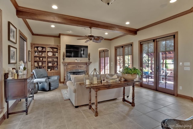 tiled living room featuring crown molding, french doors, beamed ceiling, and ceiling fan