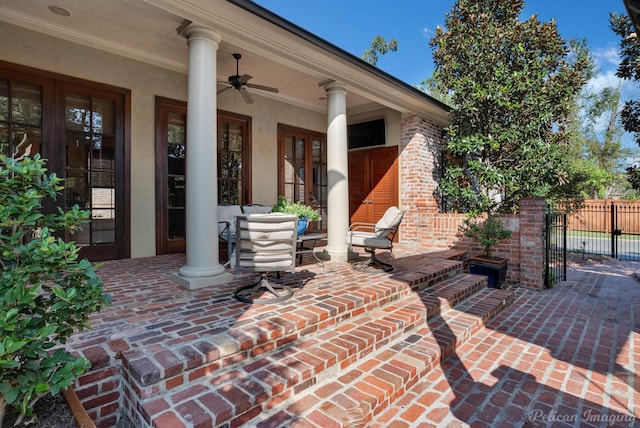 view of patio featuring ceiling fan and french doors