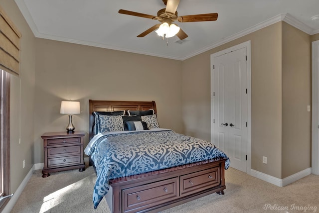 bedroom featuring ornamental molding, a closet, light colored carpet, and ceiling fan