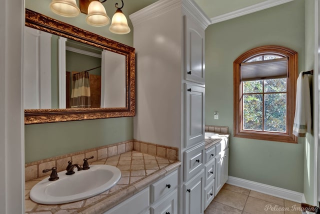 bathroom featuring ornamental molding, tile patterned flooring, and vanity