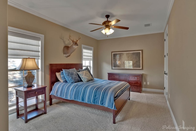 bedroom featuring ceiling fan, multiple windows, and ornamental molding