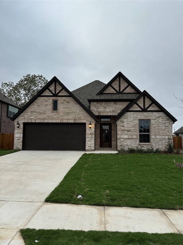 314 Mercer Dr, Josephine, TX 75173 - view of front of home with an attached garage, concrete driveway, and brick siding