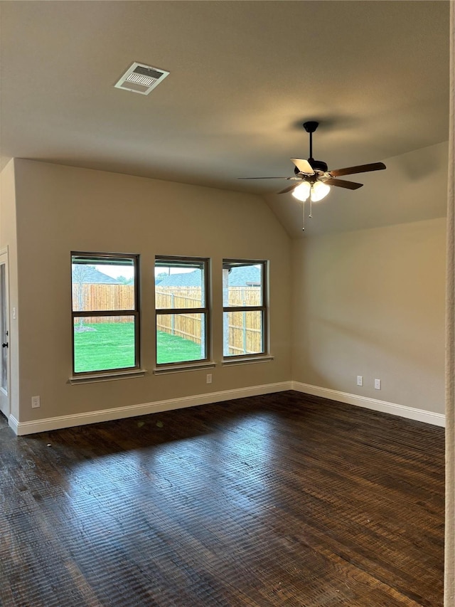 314 Mercer Dr, Josephine, TX 75173 - empty room with dark wood-type flooring, vaulted ceiling, ceiling fan, and baseboards
