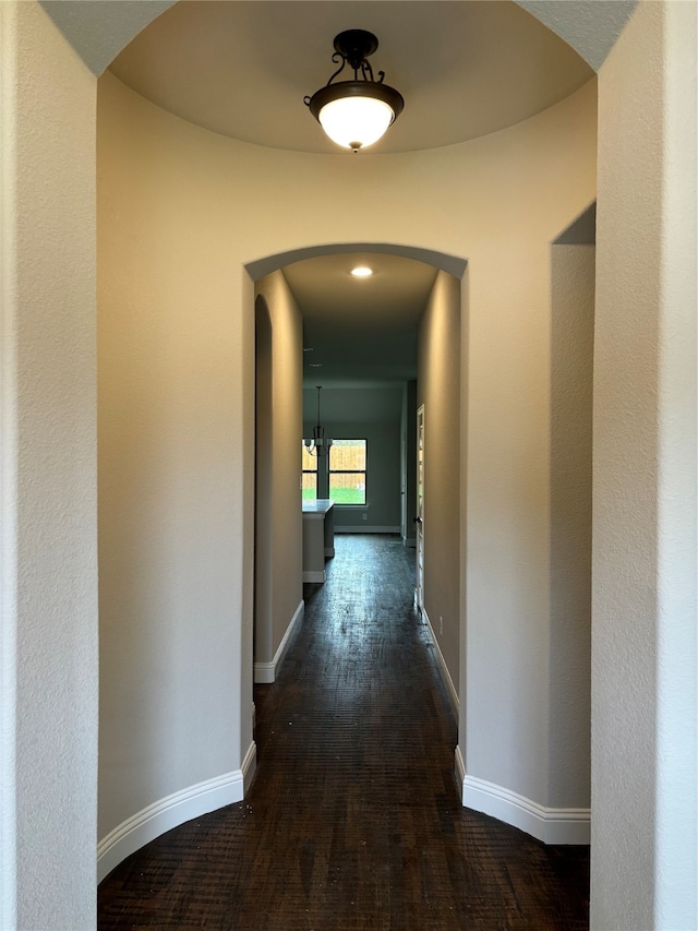 hallway with dark wood-type flooring