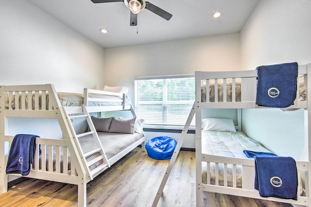 bedroom with wood-type flooring and ceiling fan