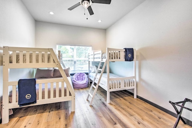 bedroom with wood-type flooring and ceiling fan