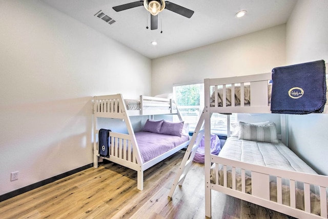 bedroom featuring hardwood / wood-style flooring and ceiling fan