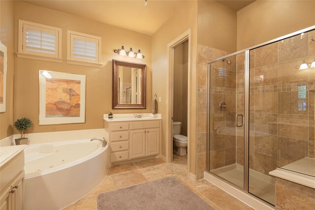 full bathroom with tile patterned flooring, vanity, independent shower and bath, and toilet