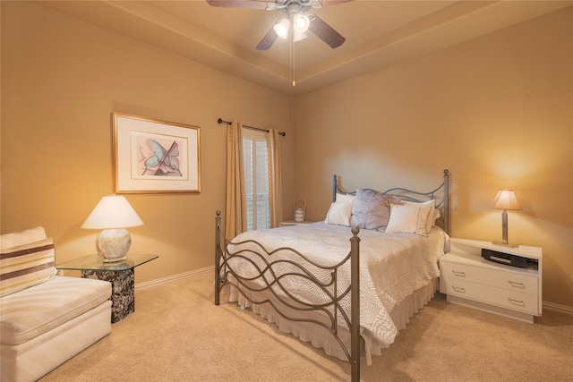 bedroom featuring ceiling fan and light carpet