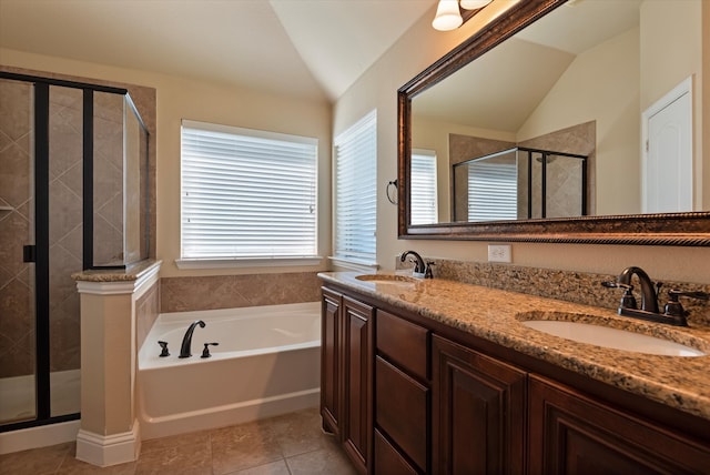 bathroom with vanity, tile patterned floors, shower with separate bathtub, and lofted ceiling