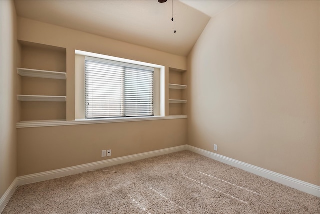 unfurnished room featuring carpet floors, ceiling fan, and vaulted ceiling