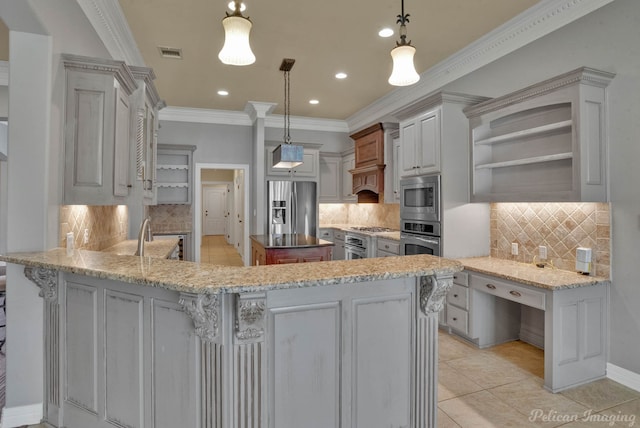 kitchen with kitchen peninsula, decorative backsplash, decorative light fixtures, and appliances with stainless steel finishes