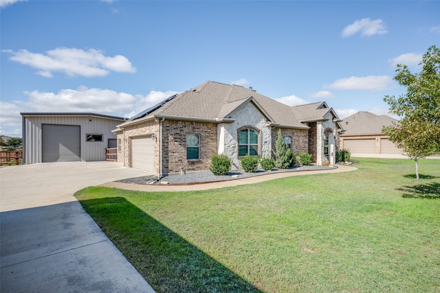 view of front of house with a garage and a front yard