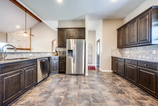 kitchen featuring lofted ceiling with beams, sink, dark brown cabinets, and stainless steel appliances