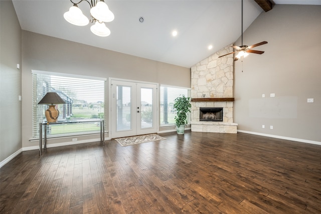 unfurnished living room featuring dark hardwood / wood-style flooring, plenty of natural light, and high vaulted ceiling