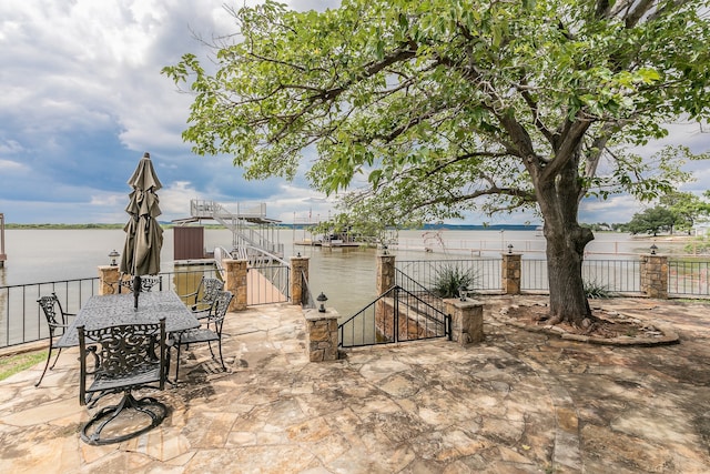 view of patio featuring a water view