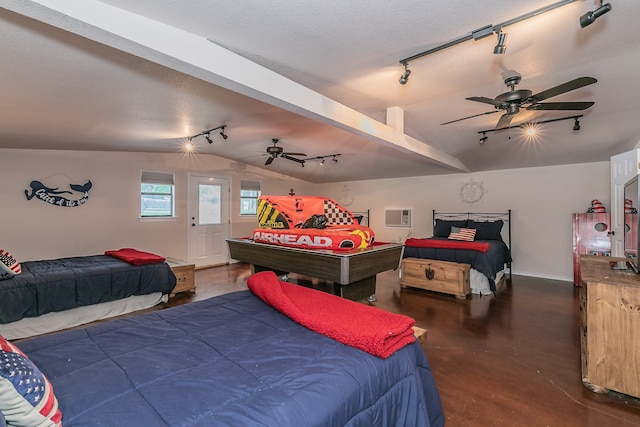 bedroom with ceiling fan, track lighting, a wall mounted air conditioner, and vaulted ceiling with beams