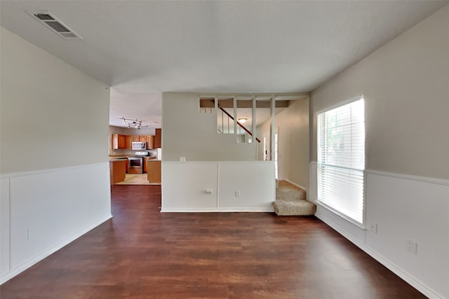 unfurnished room featuring dark hardwood / wood-style floors