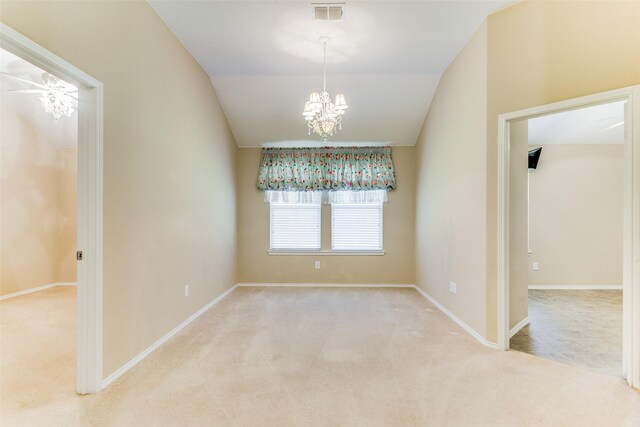 unfurnished dining area with light colored carpet, vaulted ceiling, and a notable chandelier