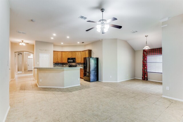 kitchen with backsplash, vaulted ceiling, ceiling fan, black appliances, and a kitchen island