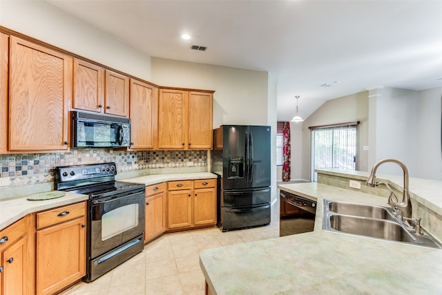 kitchen with sink, vaulted ceiling, decorative backsplash, light tile patterned flooring, and black appliances