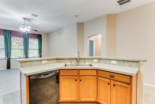 kitchen featuring ceiling fan, sink, light tile patterned floors, and black dishwasher