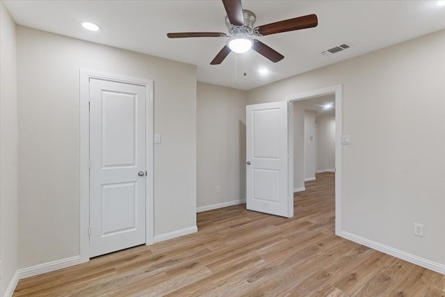 unfurnished bedroom with light hardwood / wood-style flooring and ceiling fan