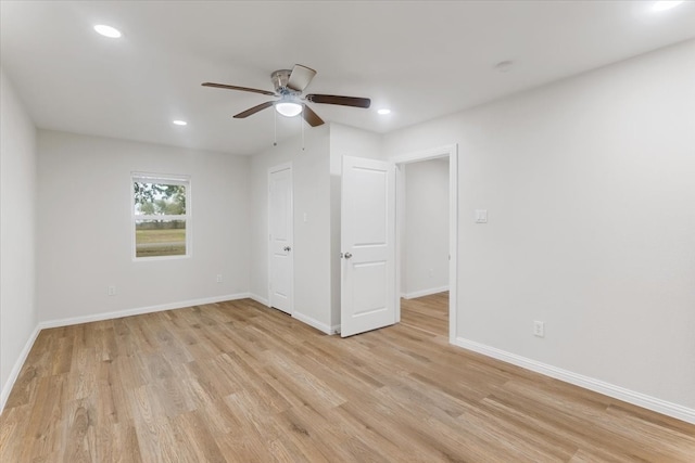 unfurnished bedroom with light hardwood / wood-style flooring and ceiling fan