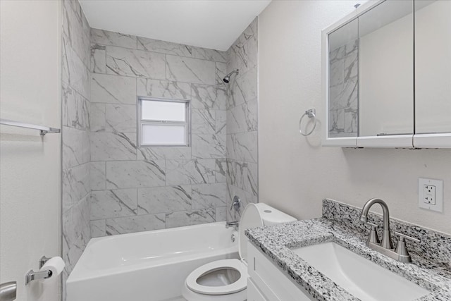 full bathroom featuring toilet, tiled shower / bath combo, and vanity