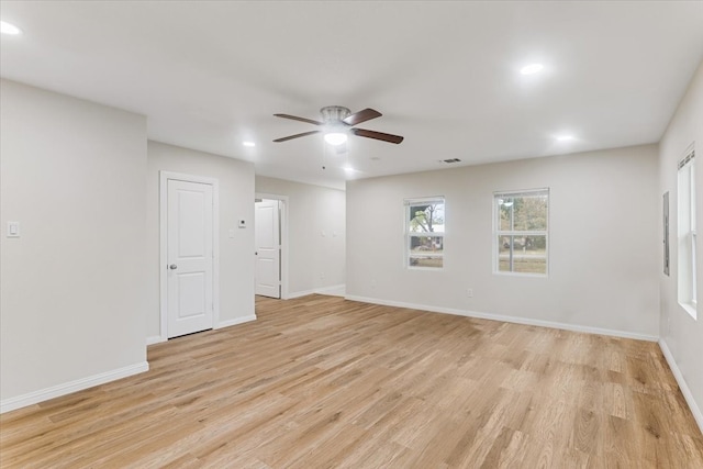 unfurnished room with light wood-type flooring and ceiling fan