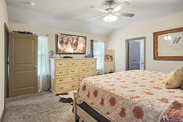 carpeted bedroom featuring ceiling fan and vaulted ceiling