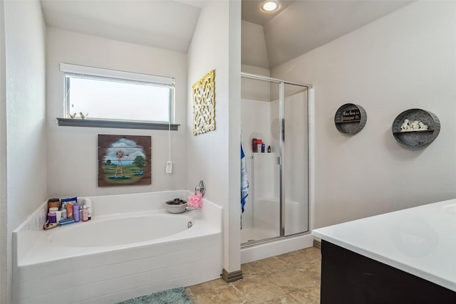 bathroom with separate shower and tub, vanity, and lofted ceiling