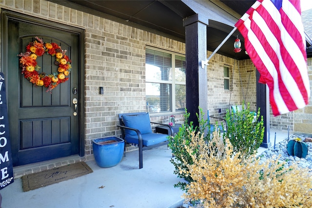 doorway to property featuring a porch