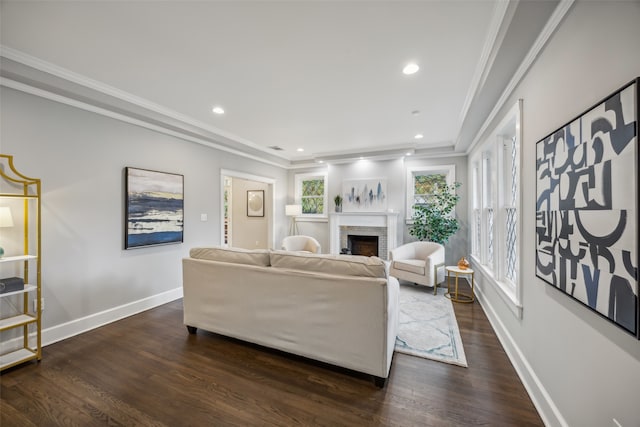 living room with dark hardwood / wood-style flooring and ornamental molding