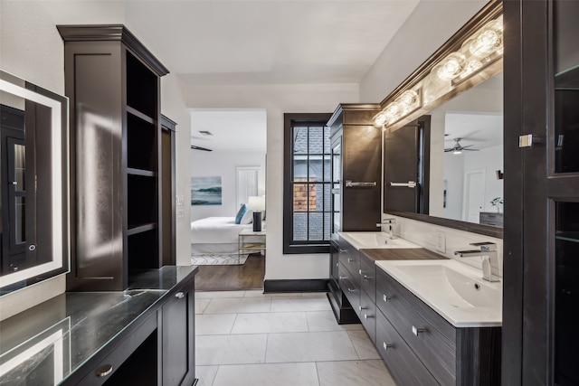 bathroom featuring vanity, ceiling fan, and wood-type flooring