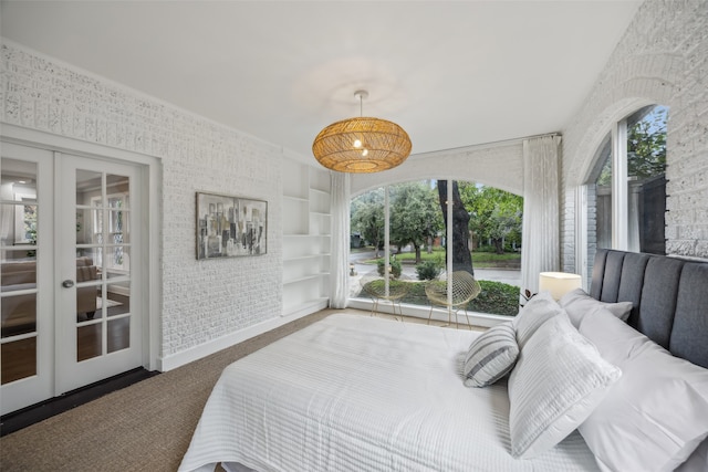 bedroom featuring french doors and carpet floors