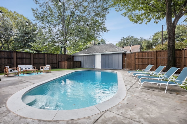 view of swimming pool featuring a patio area