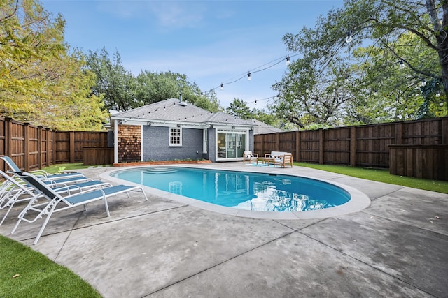 view of pool featuring a patio area