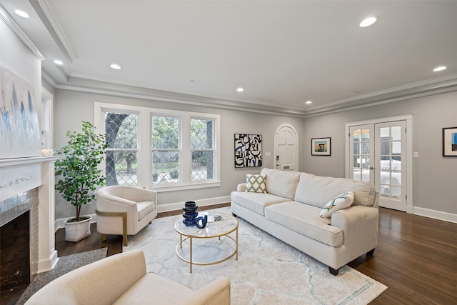 living room with dark hardwood / wood-style flooring, french doors, and ornamental molding