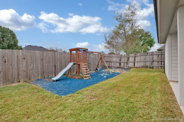 view of jungle gym featuring a lawn