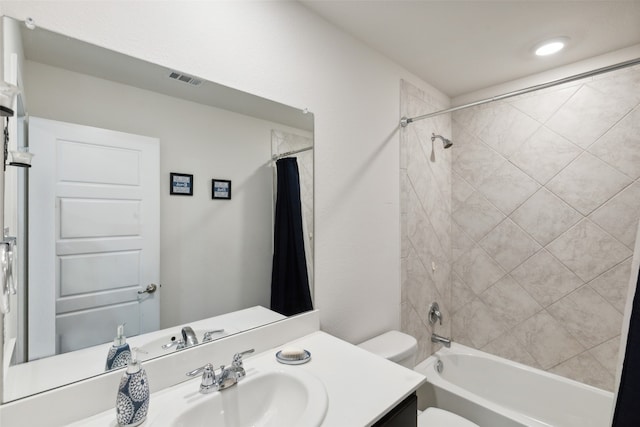 full bathroom with toilet, vanity, and shower / bath combo with shower curtain