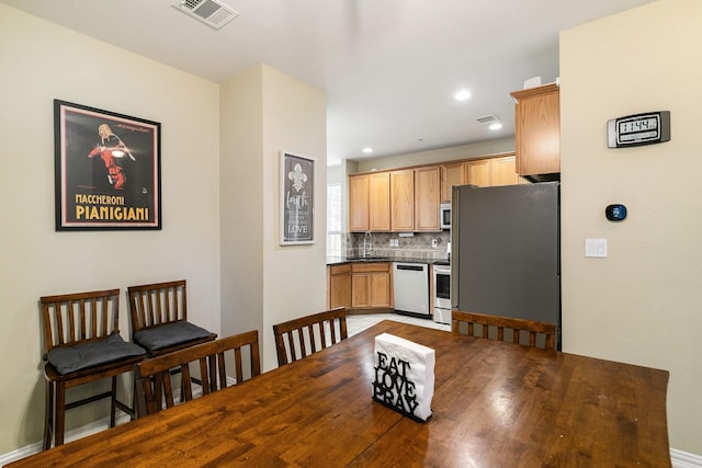 dining space with sink