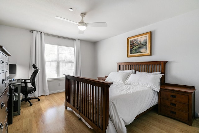 bedroom featuring light wood-type flooring and ceiling fan