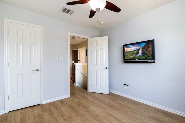 unfurnished bedroom featuring light hardwood / wood-style floors and ceiling fan