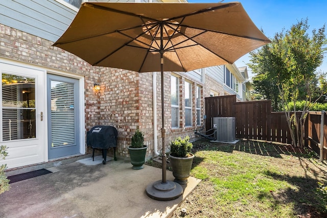 view of yard featuring cooling unit and a patio area