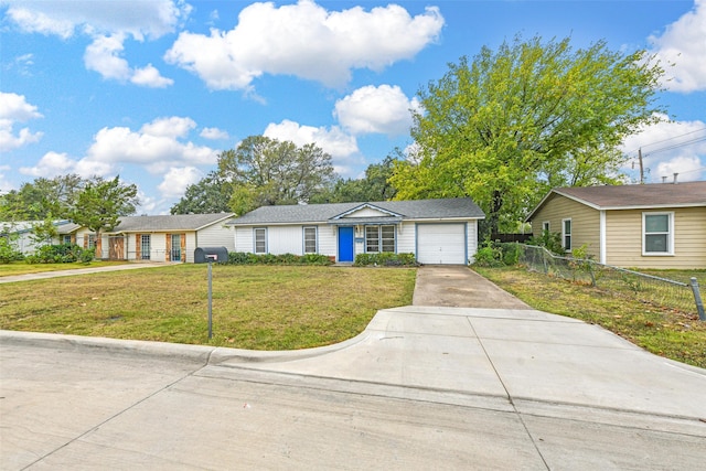 single story home with a garage and a front lawn