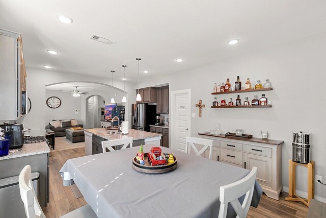 dining area featuring wood-type flooring and a wealth of natural light