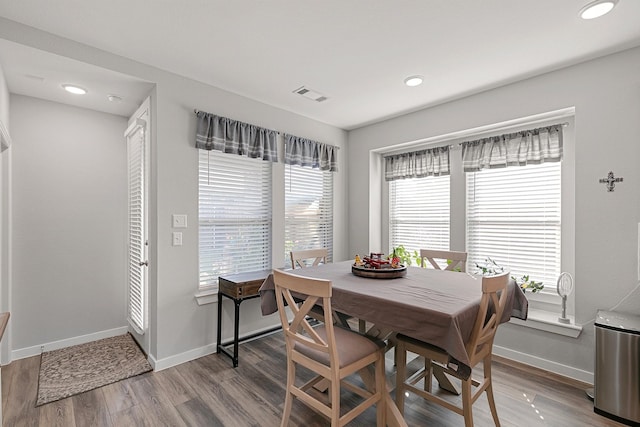 dining space featuring hardwood / wood-style flooring