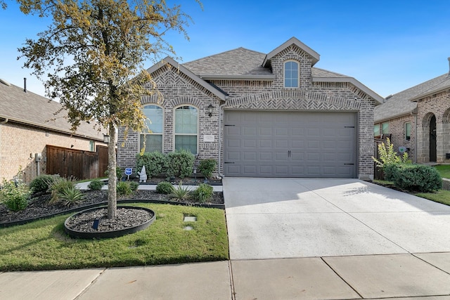 view of front facade with a front lawn and a garage