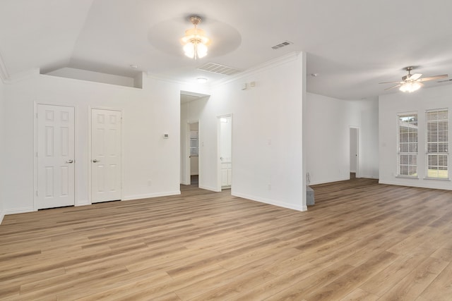 unfurnished room featuring ceiling fan, light wood-type flooring, and vaulted ceiling